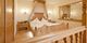 Rosensuite im Stock***** resort, großzügiger Wohnbereich, traumhafter Ausblick auf die umliegende Bergwelt und auf Mayrhofen im Zillertal.